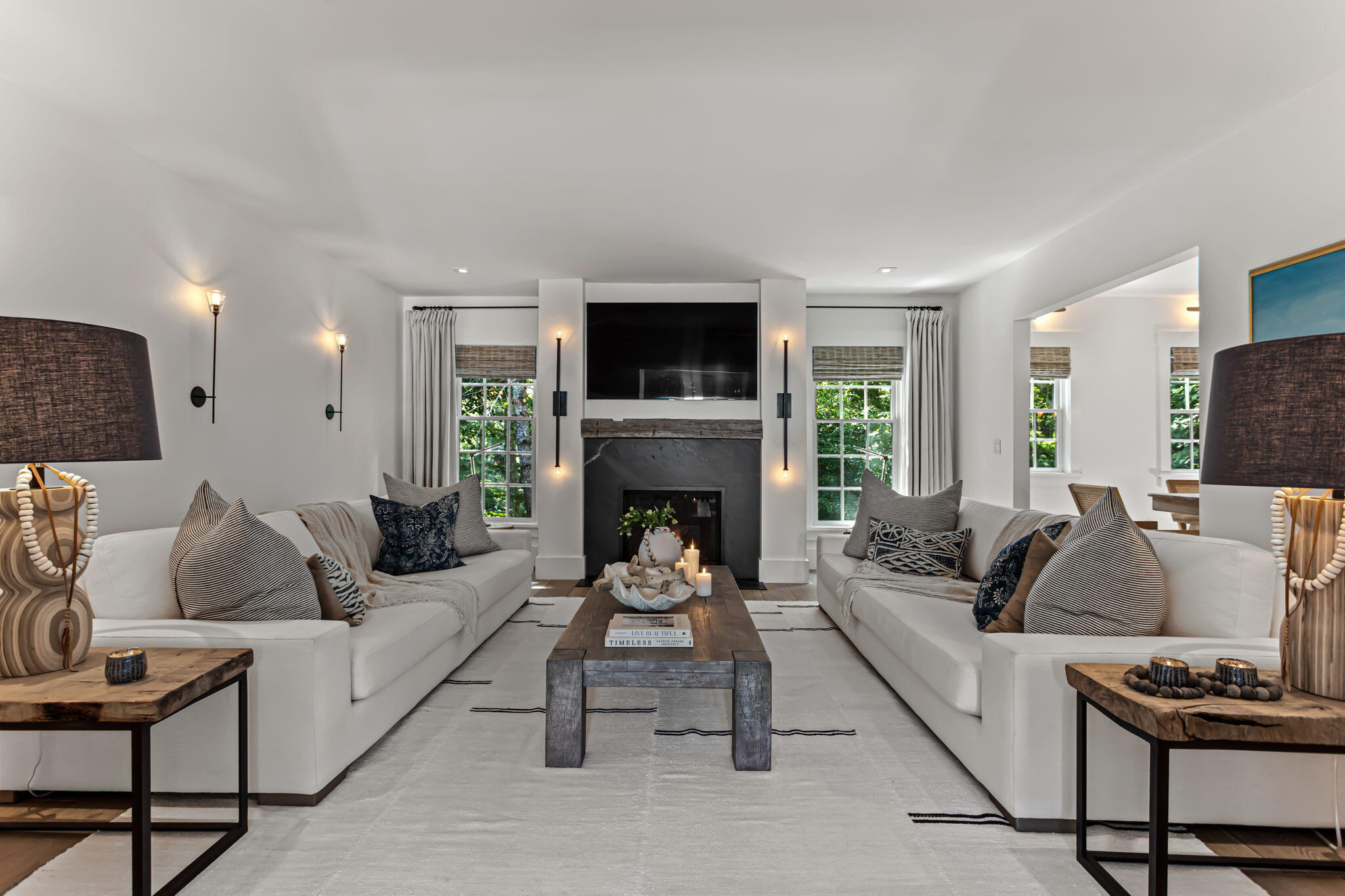 149 Old Stage Road Centerville, MA 02632 - Photo 30 of 69 a living room with furniture a flat screen tv and a fireplace