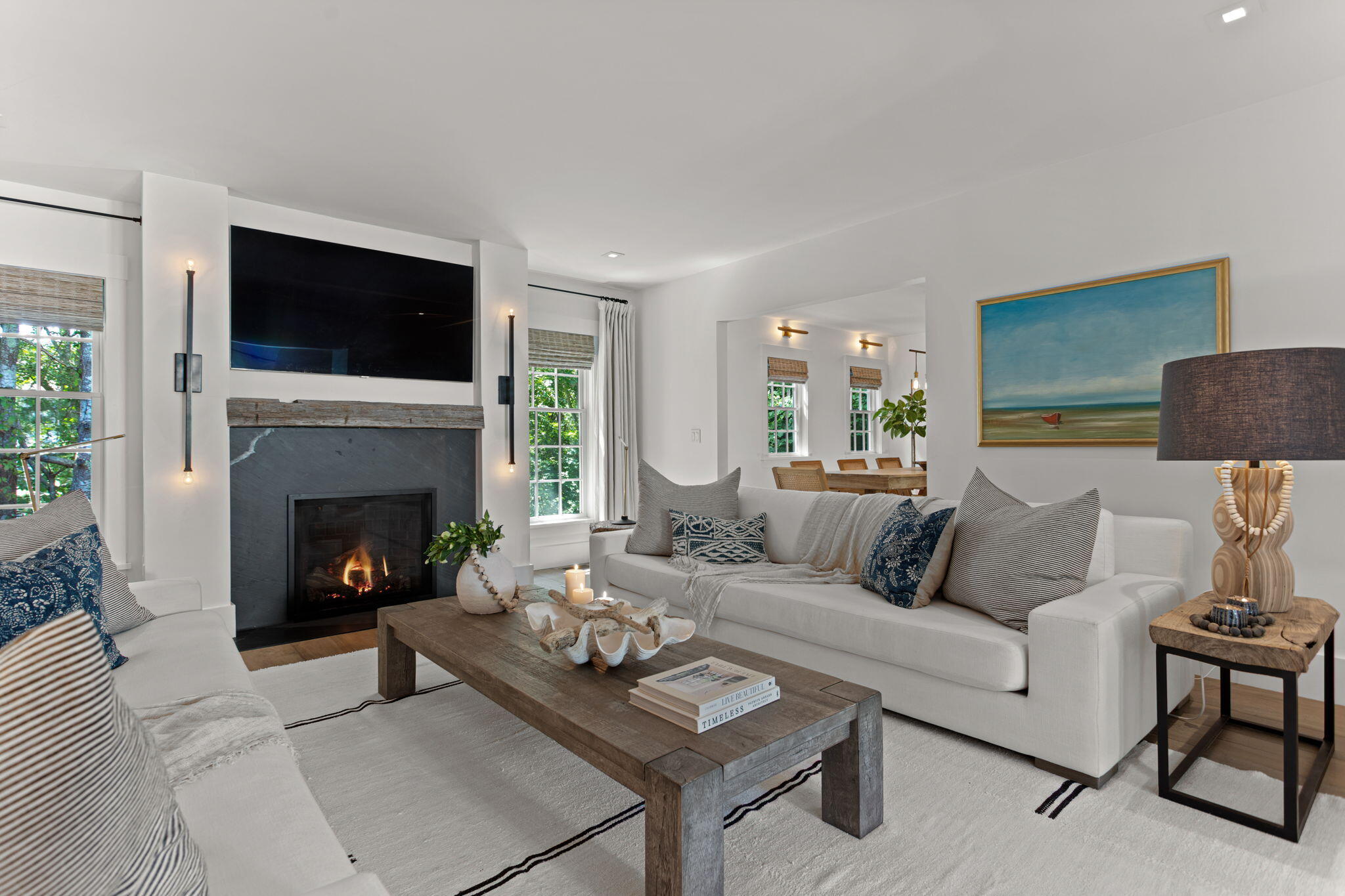 149 Old Stage Road Centerville, MA 02632 - Photo 31 of 69 a living room with furniture a flat screen tv and a fireplace