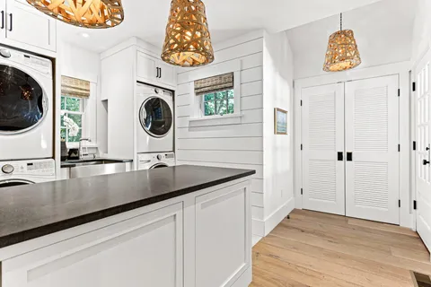 a bedroom with a bed window and a dresser