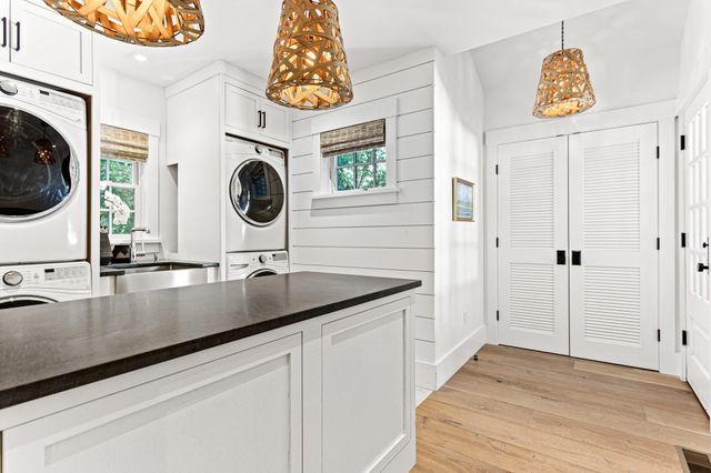 a bedroom with a bed window and a dresser