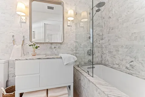 a view of a porch with chairs and backyard