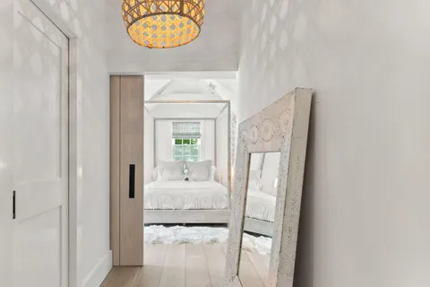 a kitchen with a sink and a mirror