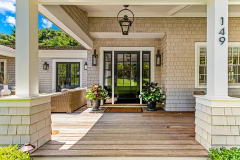 a front view of a house with a porch