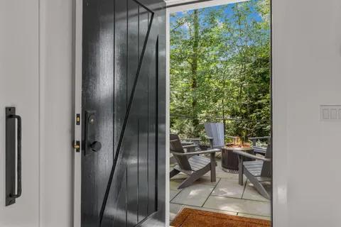 a bathroom with a toilet sink and a mirror