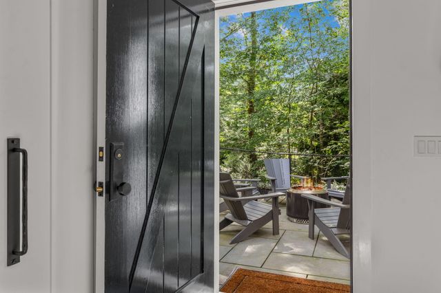 a bathroom with a toilet sink and a mirror