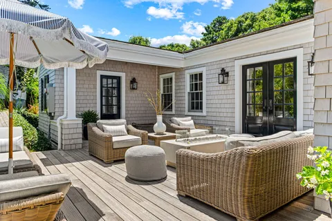 a view of a patio with couches table and chairs