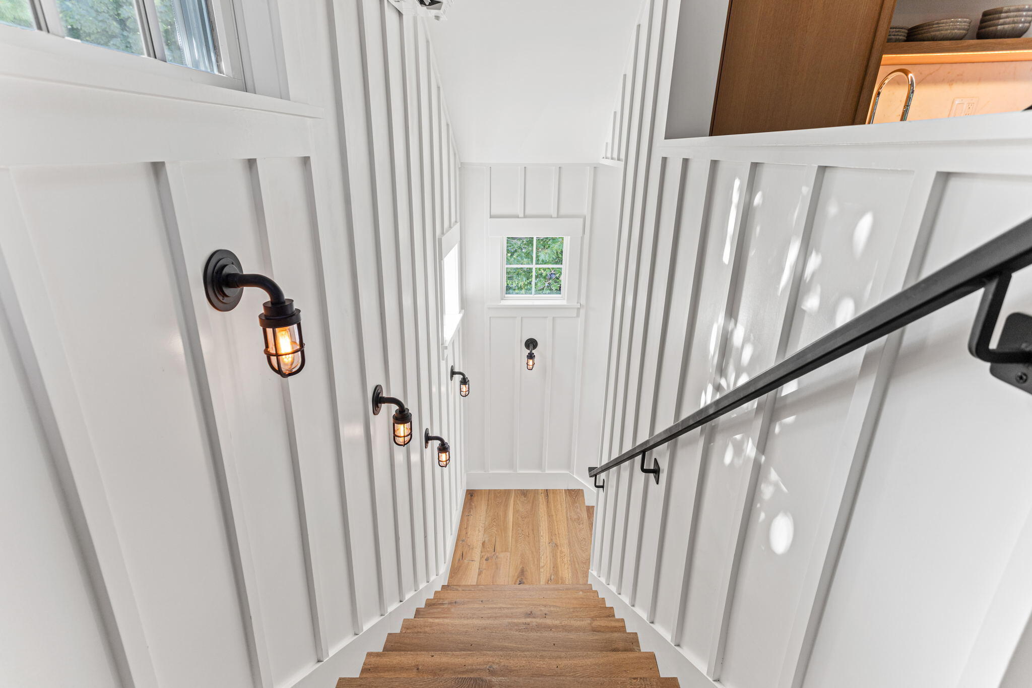 149 Old Stage Road Centerville, MA 02632 - Photo 51 of 69 a view of a hallway with wooden floor and staircase