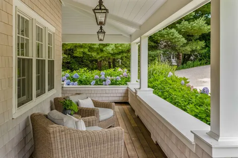 a view of a chairs and table in the patio