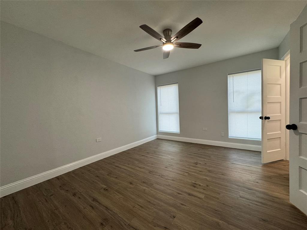 2909 Alexander Avenue Waco, TX 76708 - Photo 22 of 27 Empty room featuring dark wood-type flooring and ceiling fan