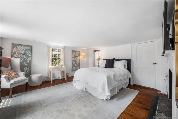 a view of a kitchen with a sink and refrigerator