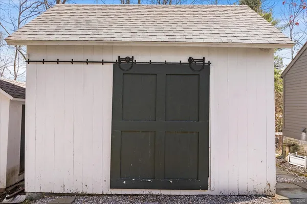 a view of a yard with large trees