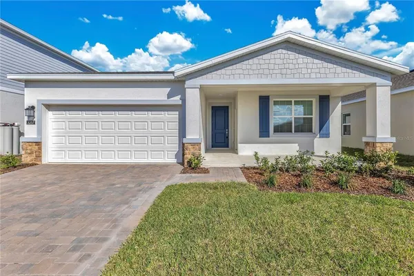 front view of a house with a yard