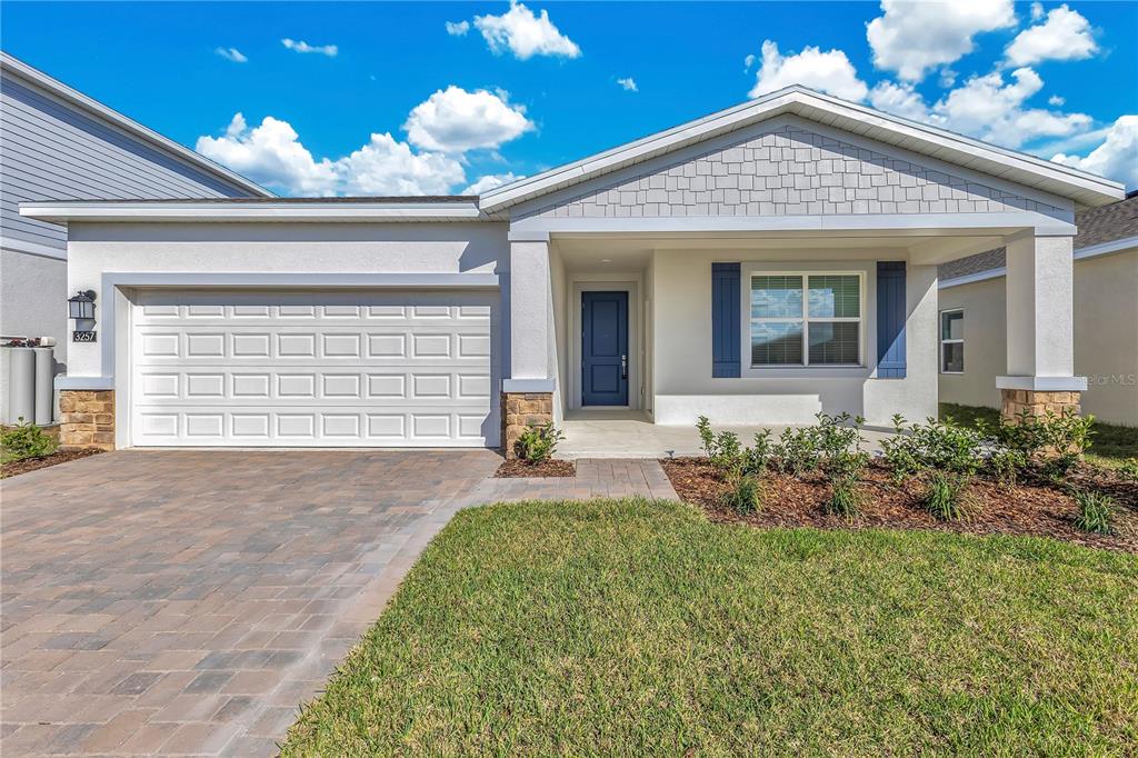 3257 Addison Boulevard, Unit B St. Cloud, FL 34771 - Photo 1 of 9 front view of a house with a yard