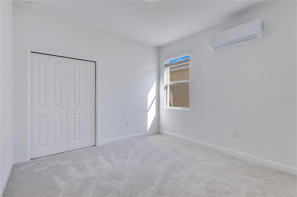 3257 Addison Boulevard, Unit B St. Cloud, FL 34771 - Photo 7 of 9 a view of an empty room with a window