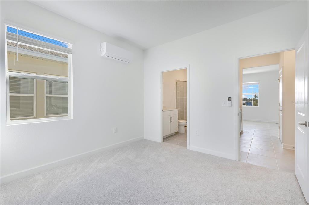 3257 Addison Boulevard, Unit B St. Cloud, FL 34771 - Photo 8 of 9 an empty room with windows and closet