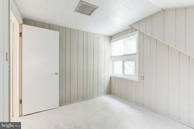 a bathroom with a sink toilet and mirror