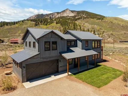 a aerial view of a house with a table and chairs