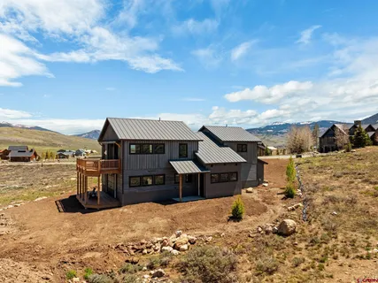 a view of ocean with a mountain
