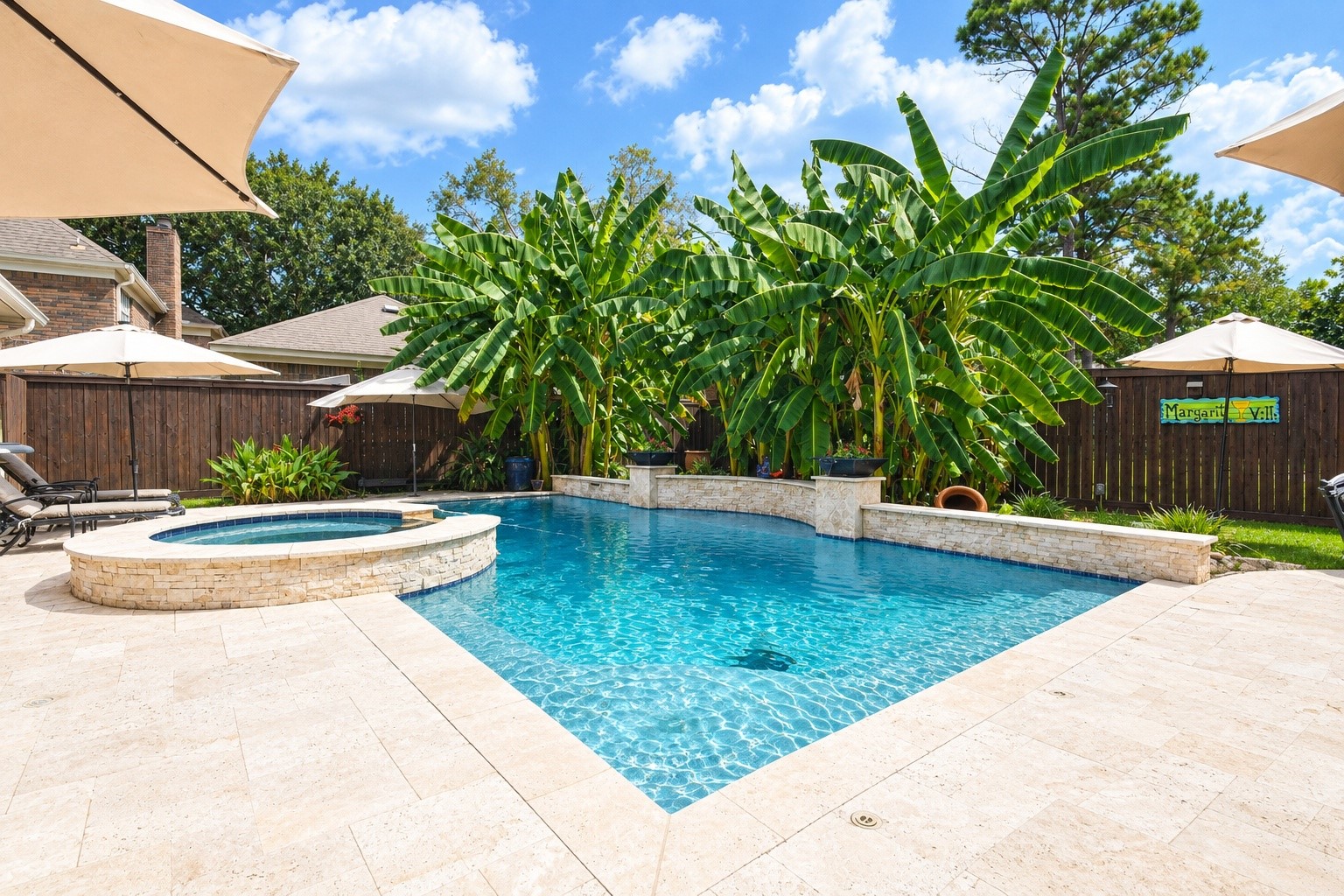 3106 Dulaney Road Houston, TX 77084 - Photo 27 of 33 The pool area features extensive travertine pool decking.