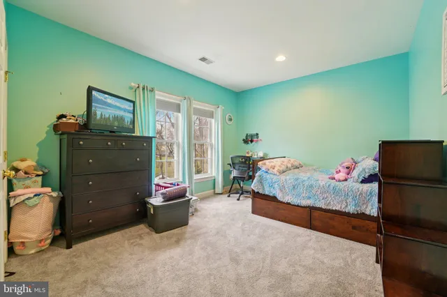 a bedroom with a bed and furniture