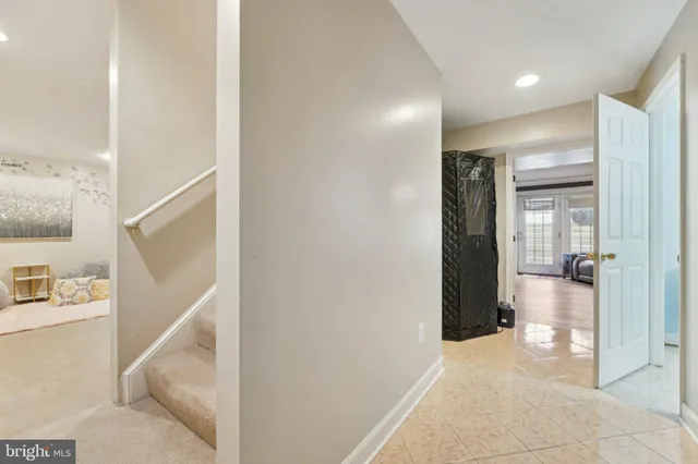 a view of hallway with bathroom and a bathtub