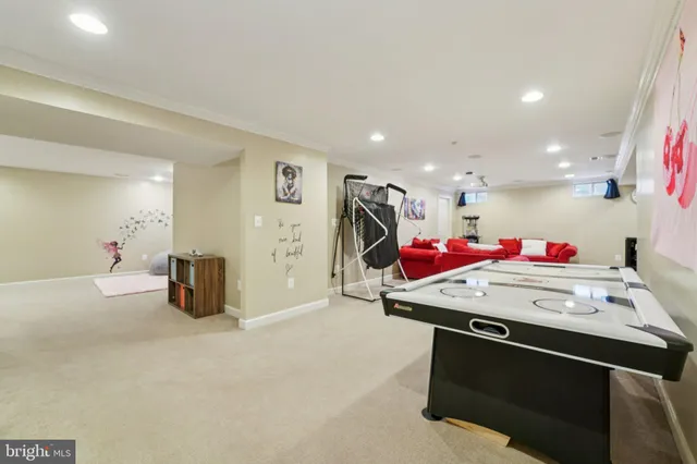a room with furniture and air hockey table