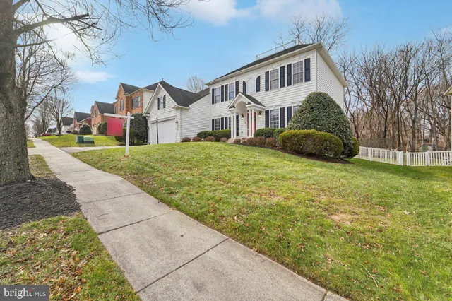 a front view of a house with yard