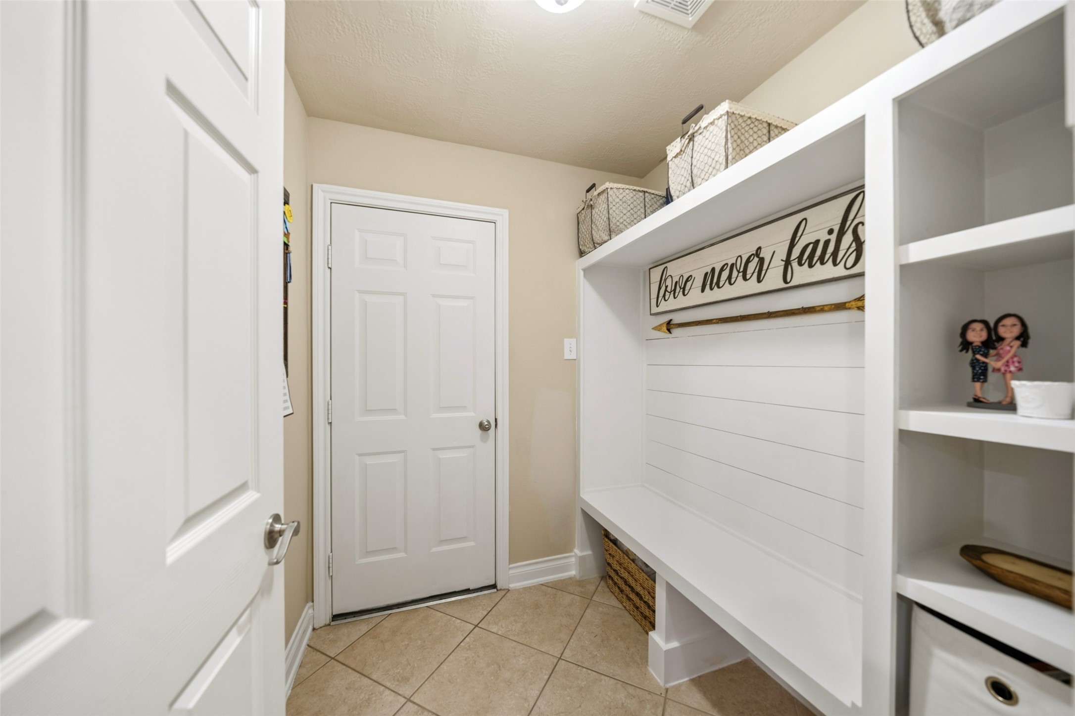 30719 Aldine Westfield Road Spring, TX 77386 - Photo 18 of 35 MUD Room Leading to Garage with Built-in Bench and Storage