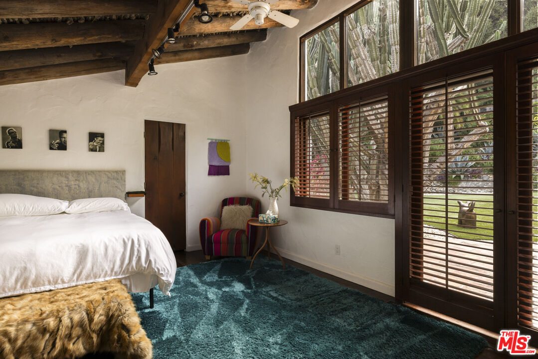 659 East Channel Road Santa Monica, CA 90402 - Photo 12 of 22 a bedroom with a bed and a large window