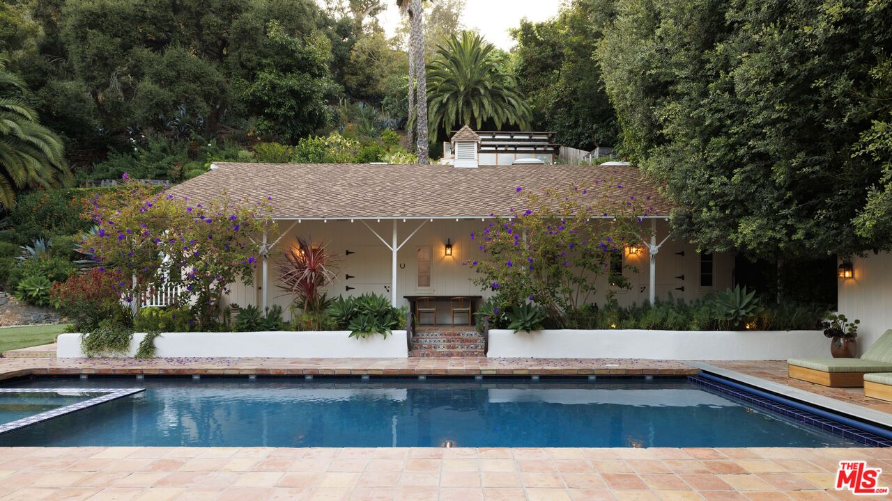 659 East Channel Road Santa Monica, CA 90402 - Photo 15 of 22 a view of a house with swimming pool and sitting area