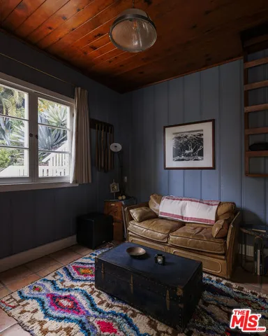 a living room with furniture and a rug
