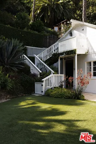 a view of swimming pool having outdoor seating