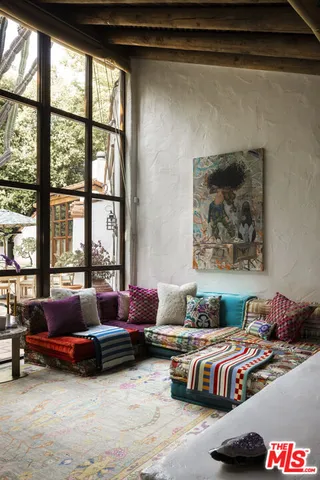 a living room with furniture and windows