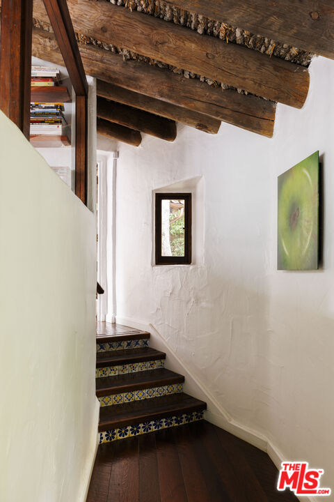 659 East Channel Road Santa Monica, CA 90402 - Photo 6 of 22 a view of a hallway with wooden floor and staircase
