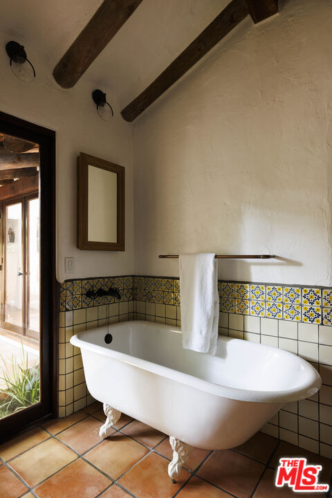 659 East Channel Road Santa Monica, CA 90402 - Photo 9 of 22 a bathroom with a sink and a bathtub