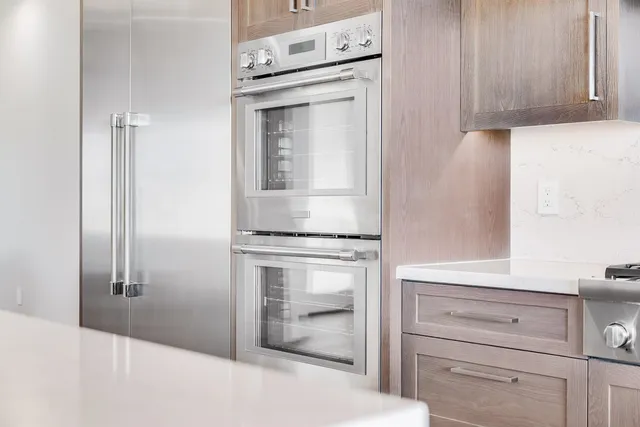a kitchen with cabinets and window