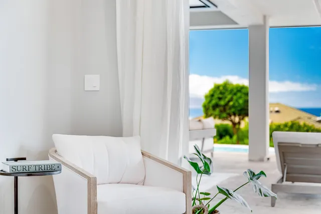 a bedroom with a bed and a painting