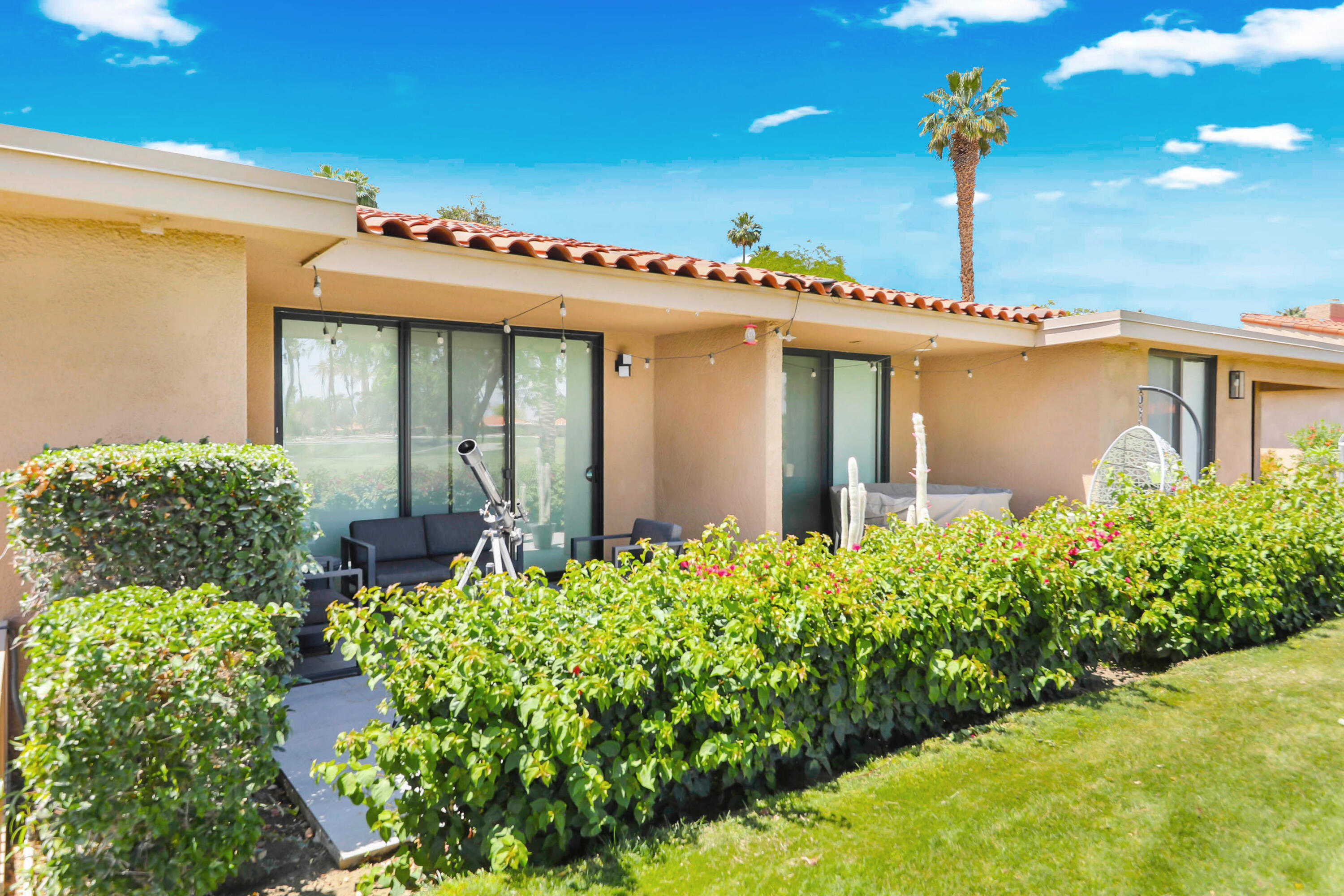 23 Haig Drive Rancho Mirage, CA 92270 - Photo 24 of 49 a front view of a house with lots of yellow lighting