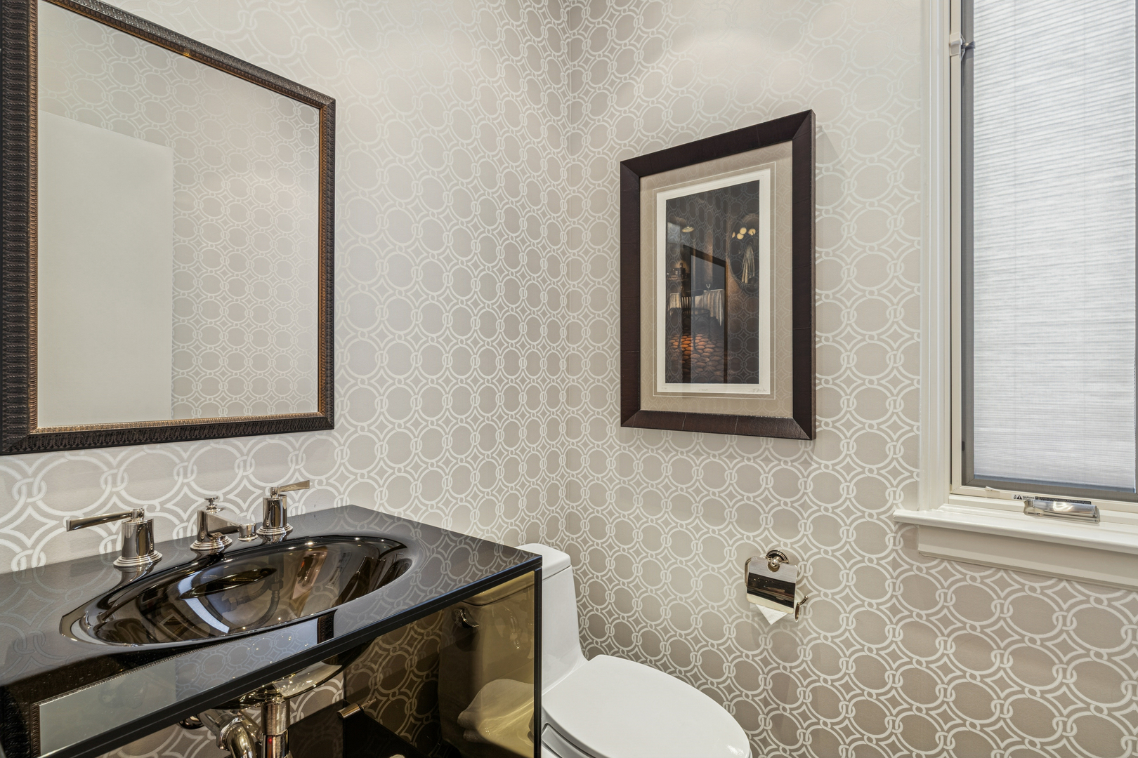 943 Westmoor Road Winnetka, IL 60093 - Photo 11 of 25 a bathroom with a toilet a sink and mirror