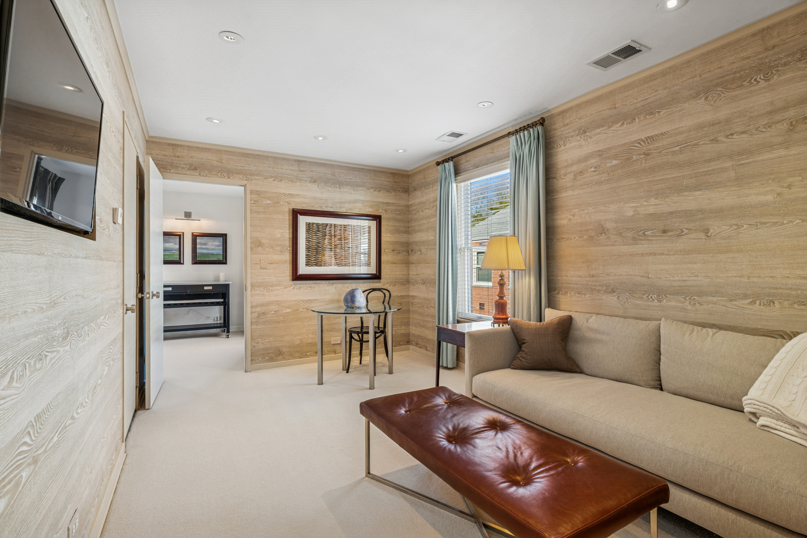 943 Westmoor Road Winnetka, IL 60093 - Photo 16 of 25 a living room with furniture and a flat screen tv