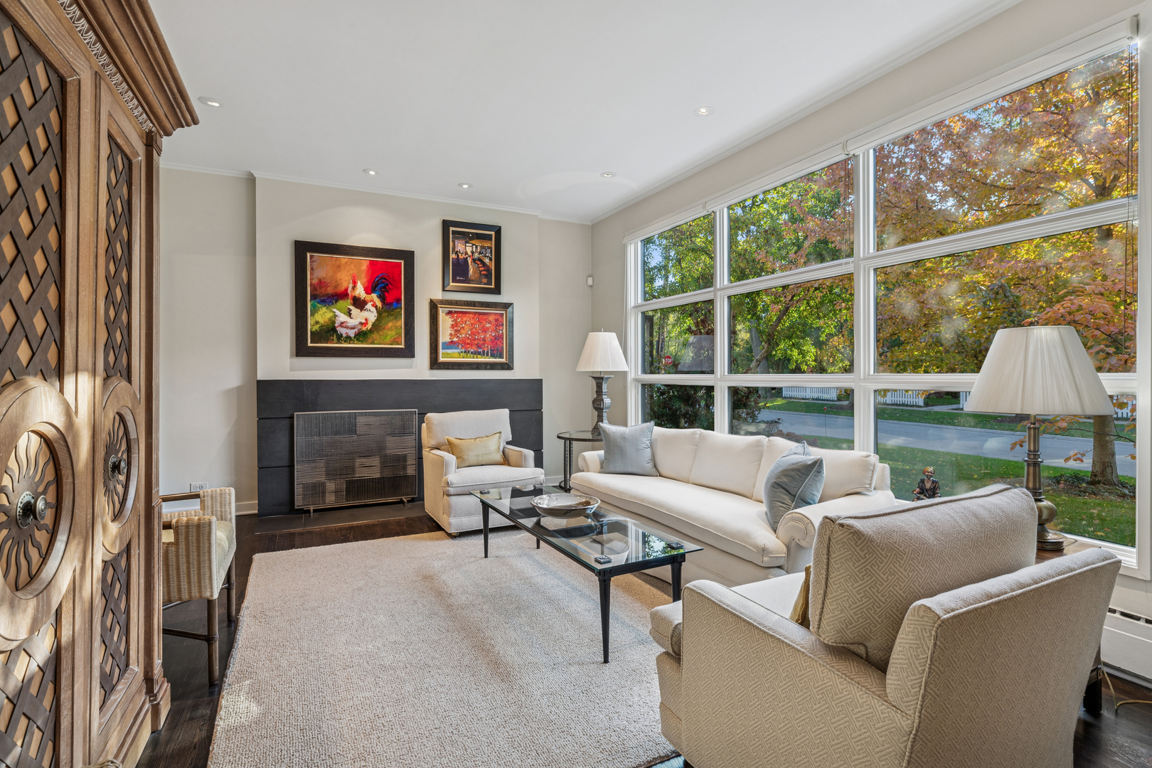 943 Westmoor Road Winnetka, IL 60093 - Photo 2 of 25 a living room with furniture a fireplace and a flat screen tv