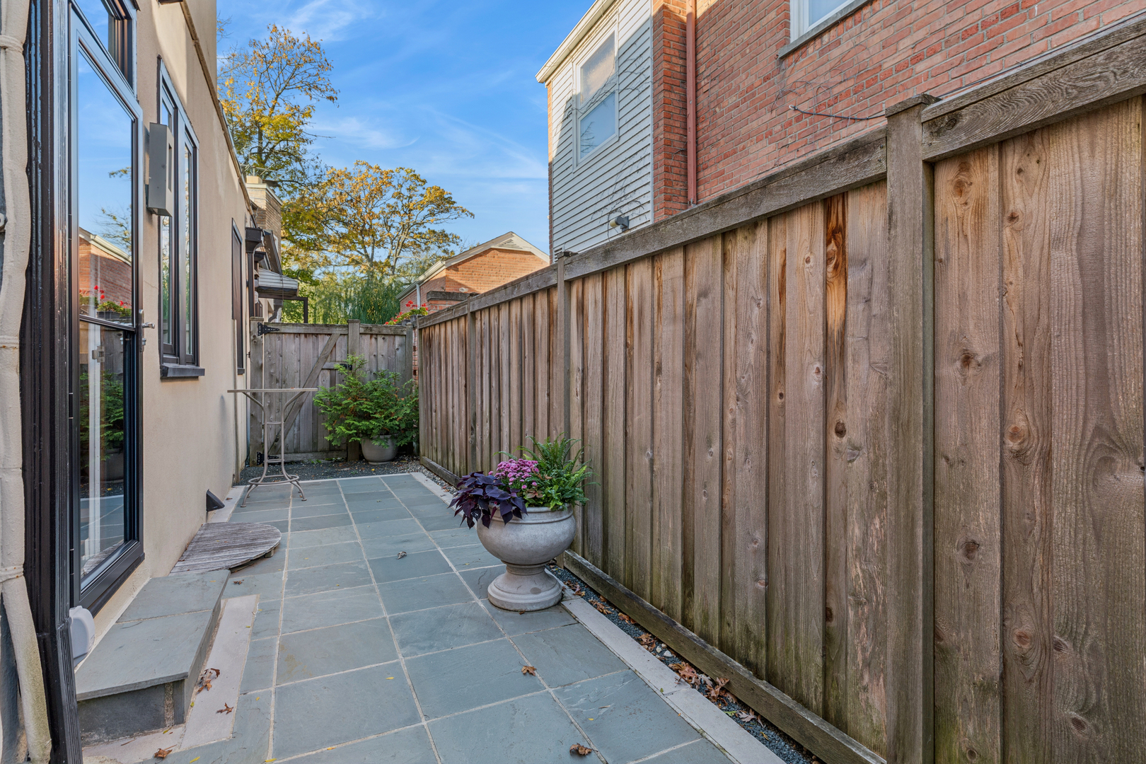 943 Westmoor Road Winnetka, IL 60093 - Photo 21 of 25 a view of a backyard with potted plants