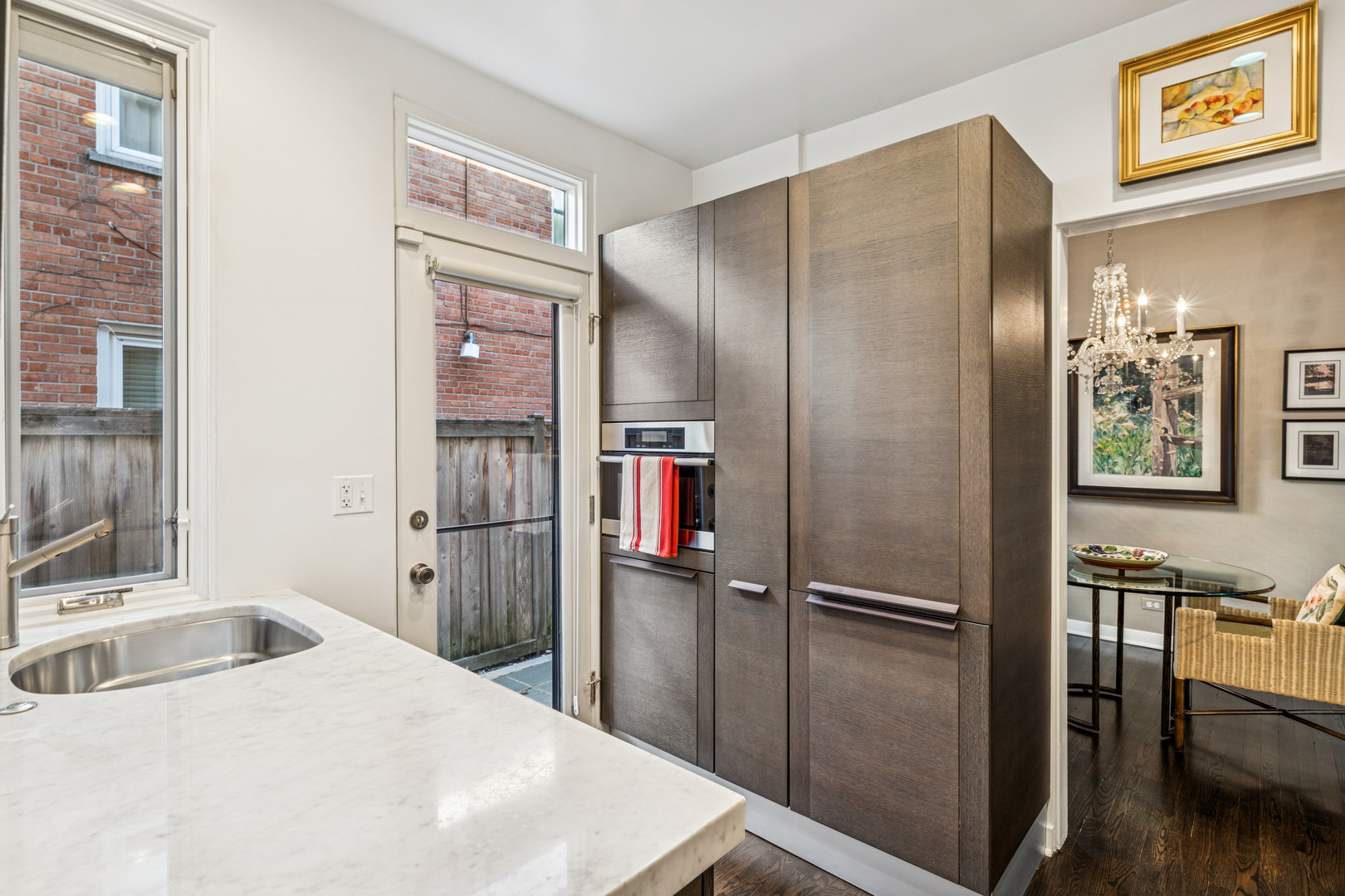 943 Westmoor Road Winnetka, IL 60093 - Photo 7 of 25 a kitchen with a refrigerator and a sink