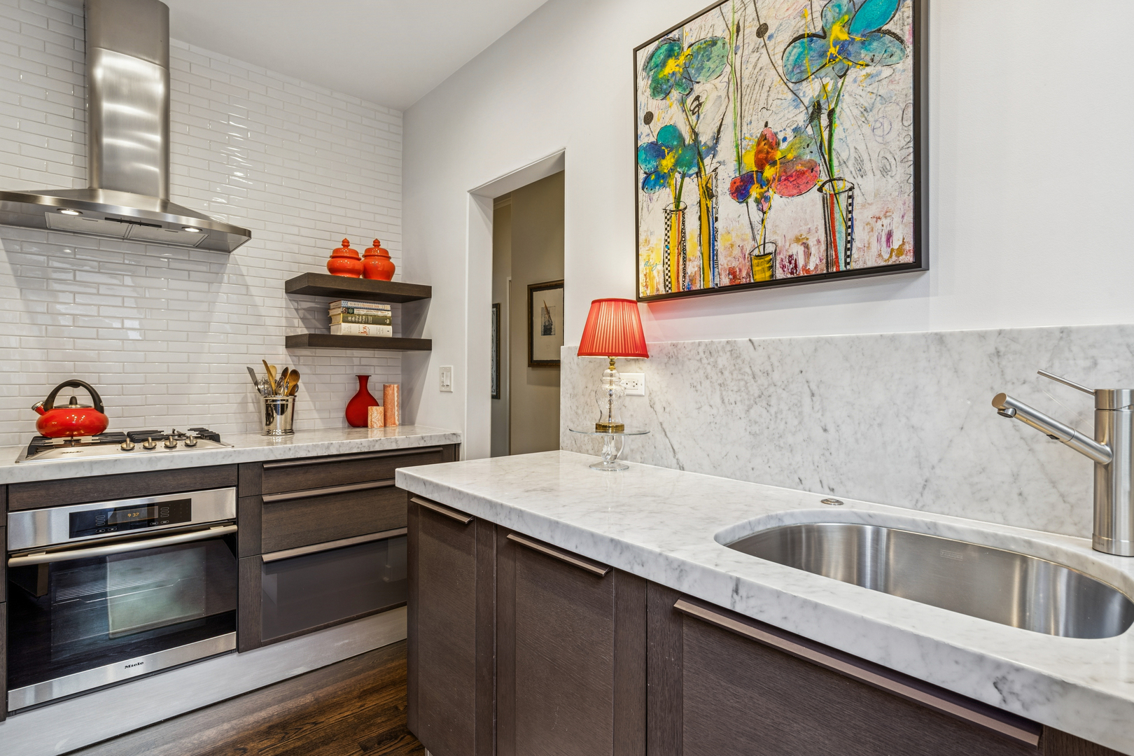 943 Westmoor Road Winnetka, IL 60093 - Photo 8 of 25 a kitchen with stainless steel appliances a stove and a sink