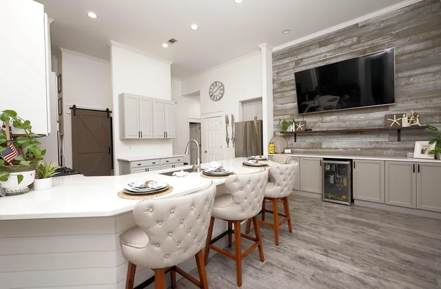 a kitchen with a refrigerator and a stove