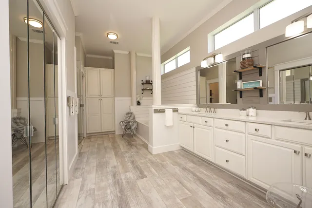 a bathroom with a tub and a shower