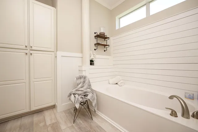 a bathroom with a sink vanity mirror and toilet
