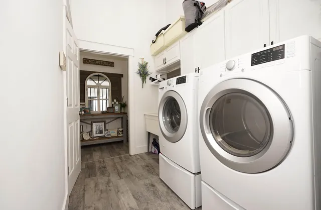 a building outdoor space with patio furniture and potted plants