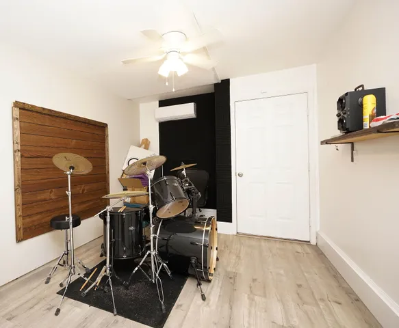 a view of a house with a yard and a garden