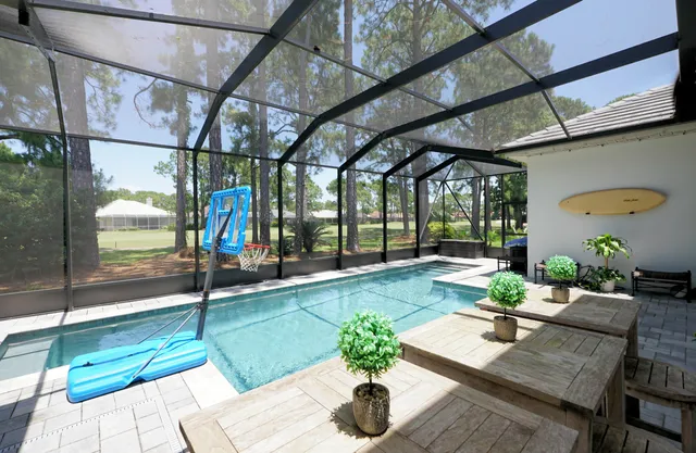 a living room with a table and chairs